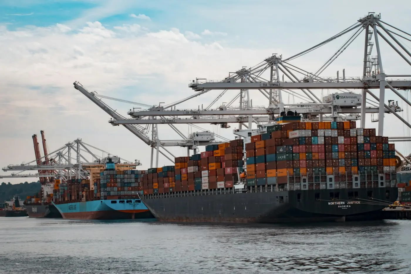 Shipping containers stacked on a vessel at a commercial port